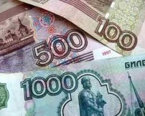 Рубль упал вместе с нефтью