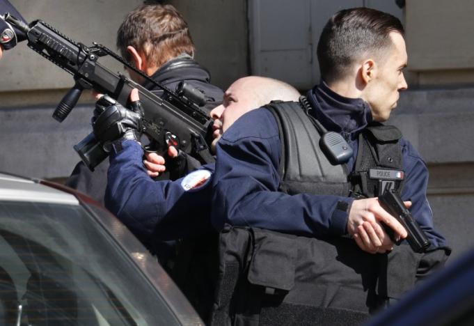 Police outside the International Monetary Fund offices where an envelope exploded in Paris