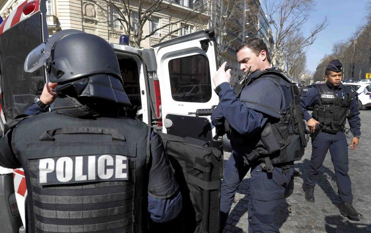 Police outside the International Monetary Fund offices where an envelope exploded in Paris