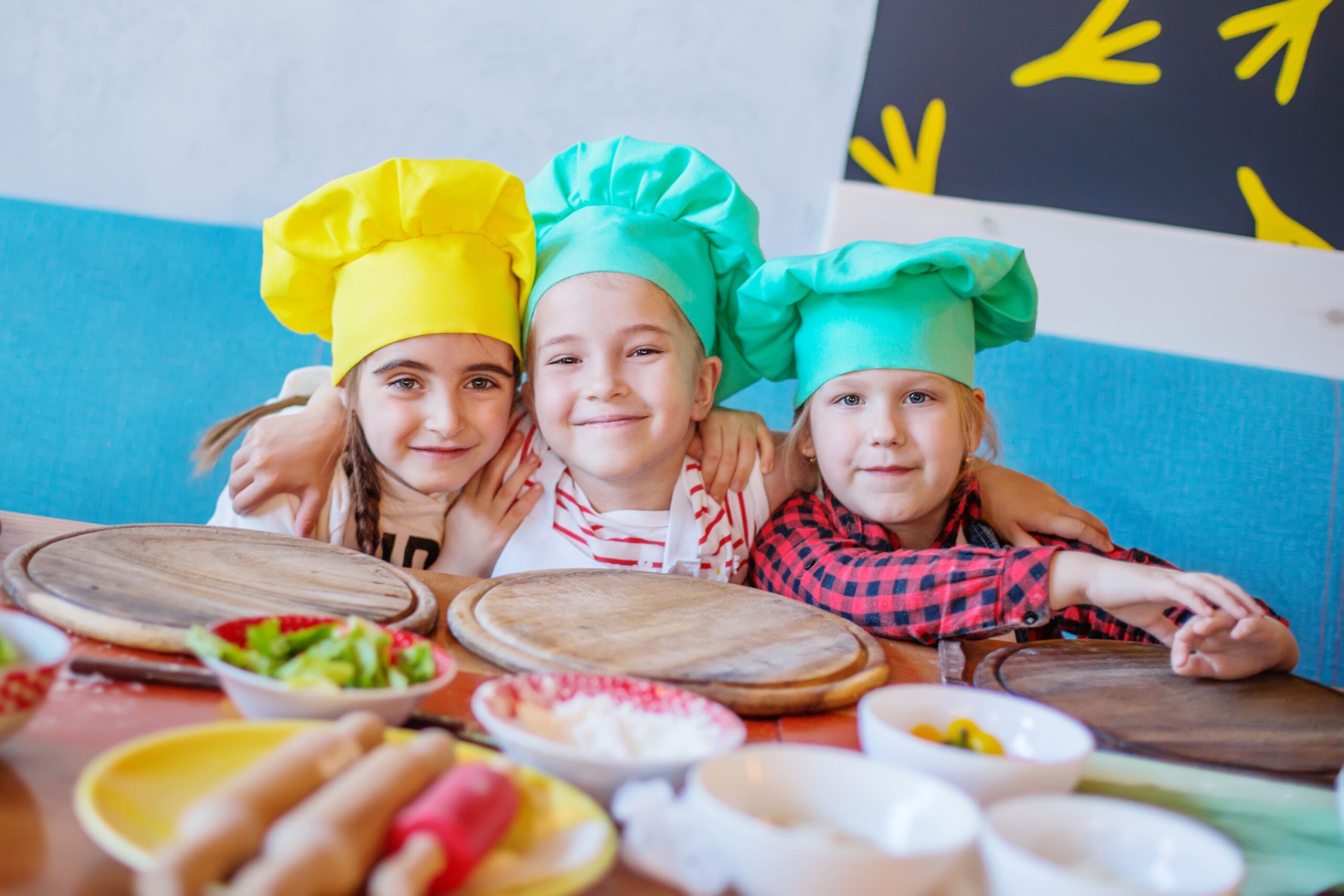 happy kids at a pizza cooking class