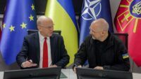 Шмигаль і Джон Гілі